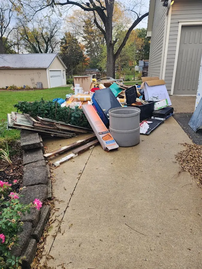 Dumpster being loaded with debris for Demolition Dumpster Rental in Silver Firs